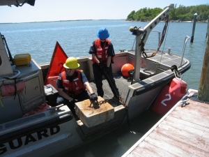 Fort Macon Coast Guard Aids to Navigation Team setting new markers Taylors Creek East Channel